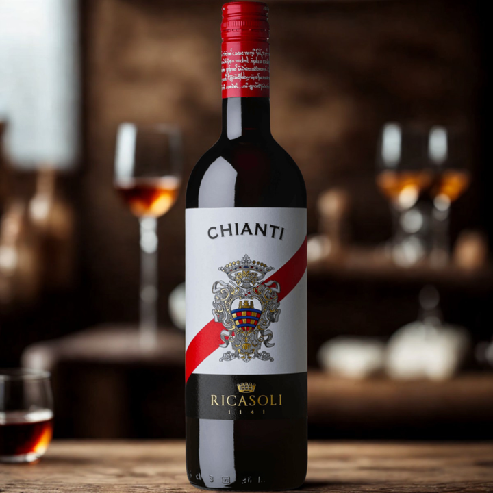 Bottle of Ricasoli Chianti wine with glasses in the background