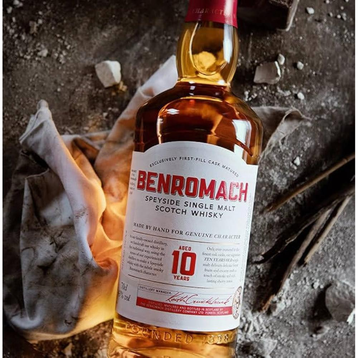 Bottle of Benromach 10-year-old Speyside Single Malt Scotch Whisky with a rustic background.